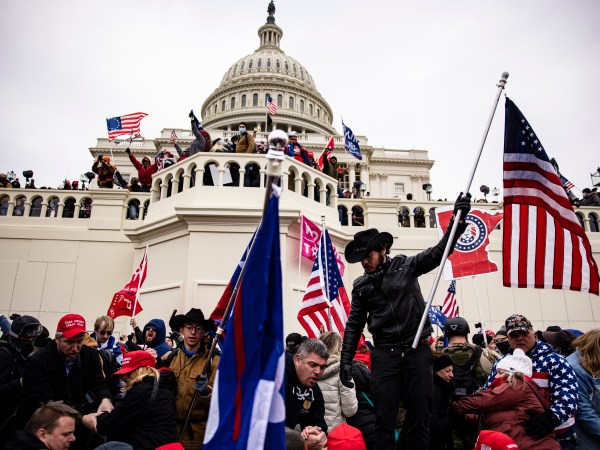 WASHINGTON, DC - JANUARY 06: Pro-Trump supporters storm the US Capitol following a rally with President Donald Trump on January 6, 2021 in Washington, DC. Trump supporters gathered in the nation's capital today to protest the ratification of President-elect Joe Biden's Electoral College victory over President Trump in the 2020 election. (Photo by Samuel Corum/Getty Images)