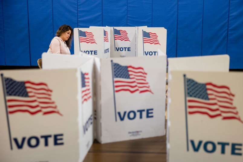 ARLINGTON, VA - MARCH 03: A woman marks down her vote on a ballot for the Democratic presidential primary election at a polling place in Armstrong Elementary School on Super Tuesday, March 3, 2020 in Arlington, Virginia. 1,357 Democratic delegates are at stake as voters cast their ballots in 14 states and American Somoa on what is known as Super Tuesday. (Photo by Samuel Corum/Getty Images)