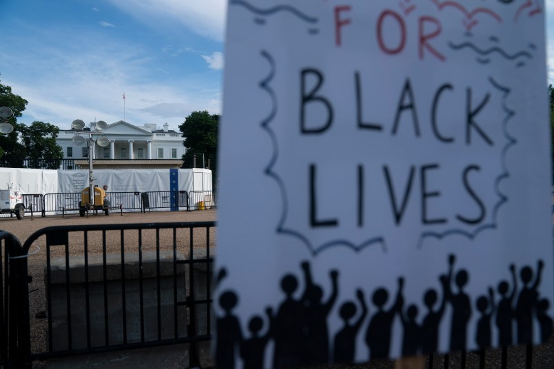 WASHINGTON D.C., June 20, 2020 -- A sign is seen during protests against racial injustice to mark Juneteenth, commemorating the end of slavery in the United States, near the White House in Washington, D.C., the United States, June 19, 2020. This year's Juneteenth comes amid nationwide demonstrations against police brutality and racism triggered by the death of George Floyd in police custody. More than 20 rallies, marches and events were scheduled for Friday in Washington, D.C., with hundreds more in over 40 states, according to the Movement for Black Lives, a coalition of U.S. groups representing the interests of black communities. (Photo by Liu Jie/Xinhua via Getty)