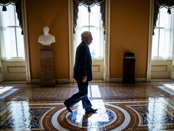 WASHINGTON, DC - JUNE 08: Senate Majority Leader Mitch McConnell (R-KY) heads got the floor of the Senate for a vote on June 8, 2021 in Washington, DC. Senate Majority Leader Chuck Schumer (D-NY) said they are now pursuing a two-path proposal that includes a new set of negotiations with a bipartisan group of senators. (Photo by Samuel Corum/Getty Images) *** Local Caption *** Mitch McConnell