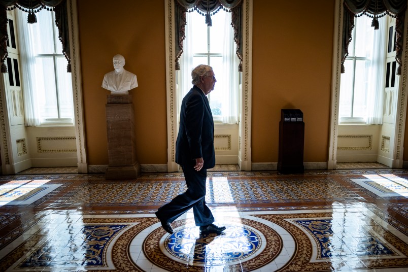 WASHINGTON, DC - JUNE 08: Senate Majority Leader Mitch McConnell (R-KY) heads got the floor of the Senate for a vote on June 8, 2021 in Washington, DC. Senate Majority Leader Chuck Schumer (D-NY) said they are now pursuing a two-path proposal that includes a new set of negotiations with a bipartisan group of senators. (Photo by Samuel Corum/Getty Images) *** Local Caption *** Mitch McConnell