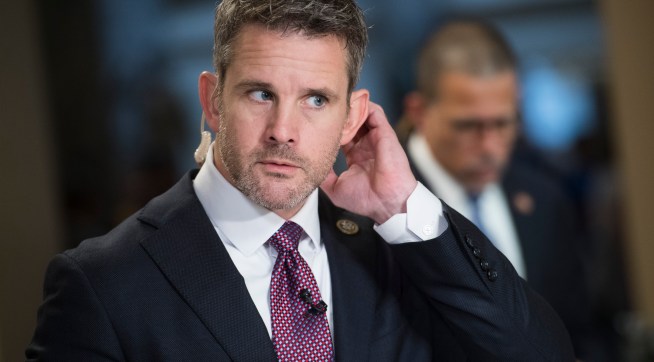 UNITED STATES - JUNE 21: Reps. Adam Kinzinger, R-Ill., left, and Anthony Brown, D-Md., prepare for television interviews in the Capitol on Friday, June 21, 2019. (Photo By Tom Williams/CQ Roll Call)