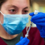 Los Angeles , CA - May 14: Alma Sevilla preparers Pfizer COVID-19 vaccine vial at a mobile vaccine clinic held at Roosevelt Park on Friday, May 14, 2021 in Los Angeles , CA. (Irfan Khan / Los Angeles Times)