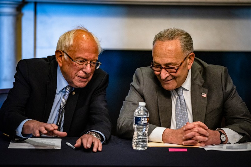 WASHINGTON, DC - JUNE 16: (R-L) U.S. Senate Majority Leader Chuck Schumer (D-NY) and Committee Chairman Bernie Sanders (D-VT) holding a meeting with Senate Budget Committee Democrats in the Mansfield Room at the U.S. Capitol building on June 16, 2021 in Washington, DC. The Majority Leader and Democrats on the Senate Budget Committee are meeting to discus how to move forward with the Biden Administrations budget proposal. (Photo by Samuel Corum/Getty Images) *** Local Caption *** Chuck Schumer; Bernie Sanders