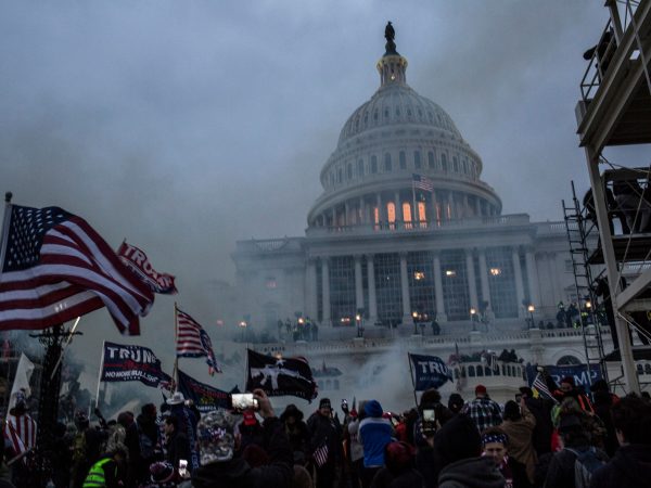 WASHINGTON, DISTRICT OF COLUMBIA, UNITED STATES - 2021/01/06: Security forces respond with tear gas after the US President Donald Trump's supporters breached the US Capitol security. Pro-Trump rioters stormed the US Capitol as lawmakers were set to sign off Wednesday on President-elect Joe Biden's electoral victory in what was supposed to be a routine process headed to Inauguration Day. (Photo by Probal Rashid/LightRocket via Getty Images)
