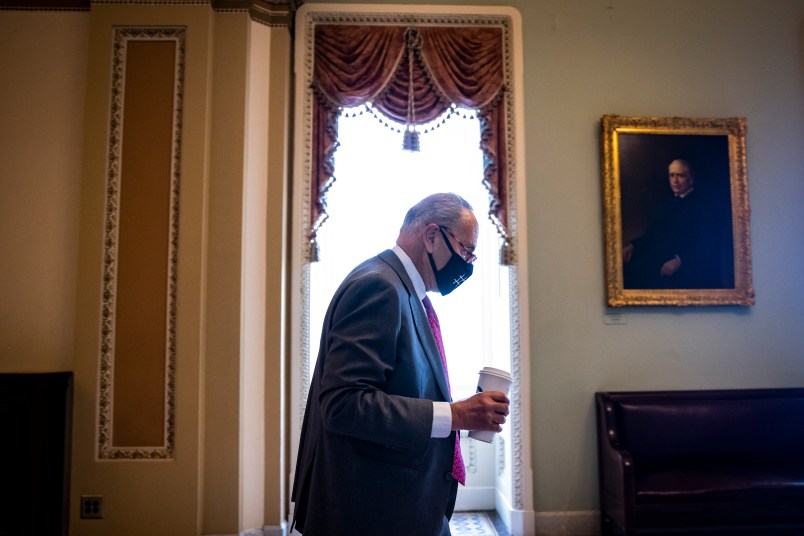 WASHINGTON, DC - AUGUST 10: U.S. Senate Majority Leader Chuck Schumer (D-NY) heads to his office in the U.S. Capitol Building on August 10, 2021 in Washington, DC. The Senate will vote today on the $1 trillion infrastructure bill ahead of August recess. (Photo by Samuel Corum/Getty Images) *** Local Caption *** Chuck Schumer