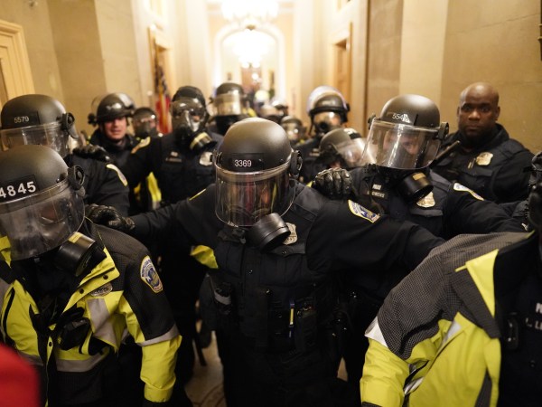 WASHINGTON, DC - JANUARY 06:  Riot police clear the hallway inside the Capitol on Wednesday, Jan. 6, 2021 in Washington, DC. (Kent Nishimura / Los Angeles Times)