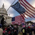 nation's capital to protest the ratification of President-elect Joe Biden's Electoral College victory over President Trump in the 2020 election. A pro-Trump mob later stormed the Capitol, breaking windows and clashing with police officers. Five people died as a result.  (Photo by Brent Stirton/Getty Images)