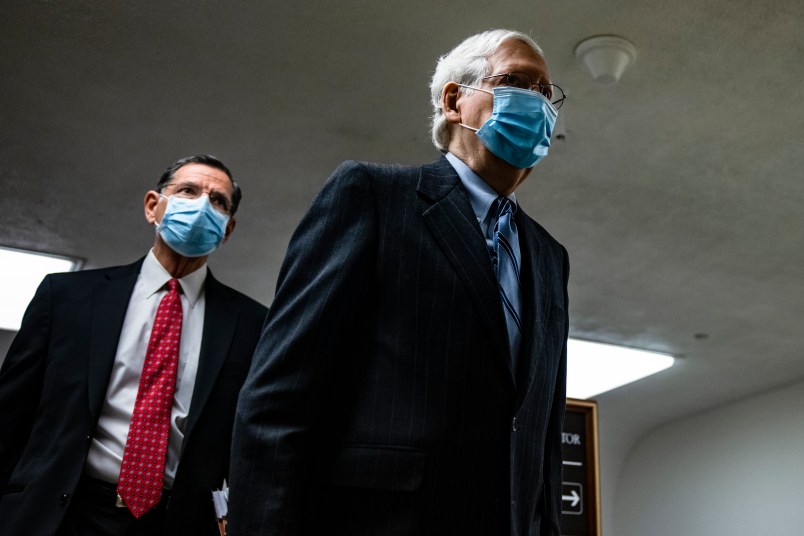 WASHINGTON, DC - FEBRUARY 12: Senate Minority Leader Mitch McConnell (R-KY) walks through the Senate subway on his way to the fourth day of the Senates second impeachment trial of former President Donald Trump at the U.S. Capitol on February 12, 2021 in Washington, DC. Trump’s defense team begins their presentation of the defense that Trump should not be held responsible for the January 6th attack at the U.S. Capitol on First Amendment grounds and the fact that he is no longer in office. (Photo by Samuel Corum/Getty Images) *** Local Caption *** Mitch McConnell