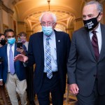 UNITED STATES - AUGUST 9: Senate Majority Leader Charles Schumer, D-N.Y., right, and Sen. Bernie Sanders, I-Vt., are seen in the U.S. Capitol on Monday, August 9, 2021. (Photo By Tom Williams/CQ Roll Call)