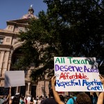 AUSTIN, TX - SEPTEMBER 11: Abortion rights activists rally at the Texas State Capitol on September 11, 2021 in Austin, Texas. Texas Lawmakers recently passed several pieces of conservative legislation, including SB8, which prohibits abortions in Texas after a fetal heartbeat is detected on an ultrasound, usually between the fifth and sixth weeks of pregnancy. (Photo by Jordan Vonderhaar/Getty Images)