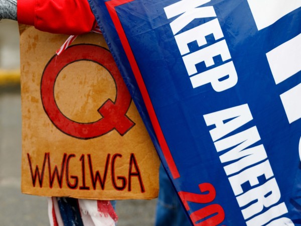 SALEM, OREGON, USA - MAY 2: The Q-Anon conspiracy theorists  hold signs during the protest at the State Capitol in Salem, Oregon, United States on May 2, 2020. Demonstrators protested Oregonâs economic-closure efforts aimed at minimizing the lethal impact of novel coronavirus (COVID-19). One of many rallies nationwide that have been linked to Republican and right-wing operatives of the Trump administration. (Photo by John Rudoff/Anadolu Agency via Getty Images)