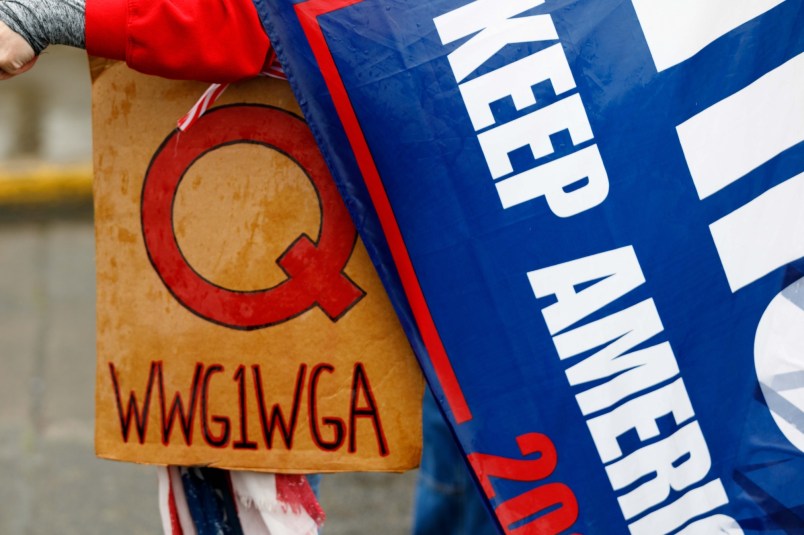 SALEM, OREGON, USA - MAY 2: The Q-Anon conspiracy theorists  hold signs during the protest at the State Capitol in Salem, Oregon, United States on May 2, 2020. Demonstrators protested Oregonâs economic-closure efforts aimed at minimizing the lethal impact of novel coronavirus (COVID-19). One of many rallies nationwide that have been linked to Republican and right-wing operatives of the Trump administration. (Photo by John Rudoff/Anadolu Agency via Getty Images)