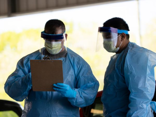 SPRINGFIELD, TN - APRIL 18:  Medical personnel work at a drive thru coronavirus (covid-19) testing site at Robertson County Fairgrounds on April 18, 2020 in Springfield, Tennessee. Tennessee drive thru testing sites now allow those without symptoms of coronavirus (covid-19) to receive testing. (Photo by Brett Carlsen/Getty Images)