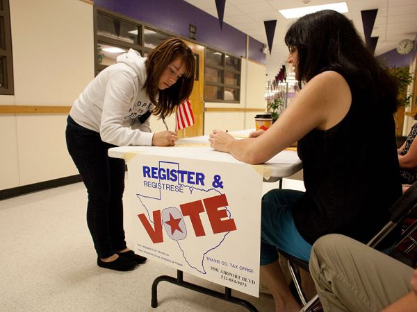 A voter registration drive for new 18-year-old voters and staff at Lyndon Baines Johnson (LBJ) High School in Austin, TX is conducted by non-partisan parent volunteers. About two dozen were registered in two hours with the effort.