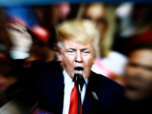 A slow shutter speed image of former US president Donald Trump on a TV screen is seen in this photo illustration in Warsaw, Poland on 23 February, 2022. (Photo by STR/NurPhoto)